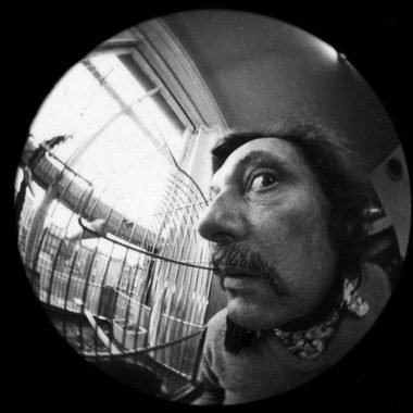 Bob Godfrey peering through a fisheye lens at his studio window